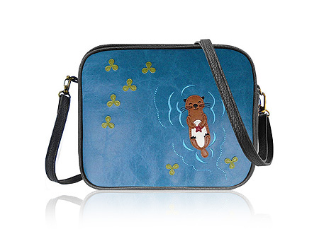 LAVISHY Adora collection wholesale fun & Eco-friendly Sea otter holding starfish applique vegan applique crossbody bags to gift shops, clothing & fashion accessories boutiques, book stores in Canada, USA & worldwide since 2001.