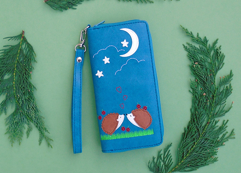 LAVISHY Adora collection wholesale kissing hedgehog lovers under the moon applique vegan large wristlet wallets to gift shop, clothing & fashion accessories boutique, book store in Canada, USA & worldwide since 2001.