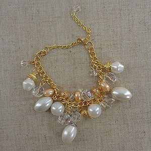 Collection of faux pearl and 'Paris Souvenirs' charm costume jewelry
