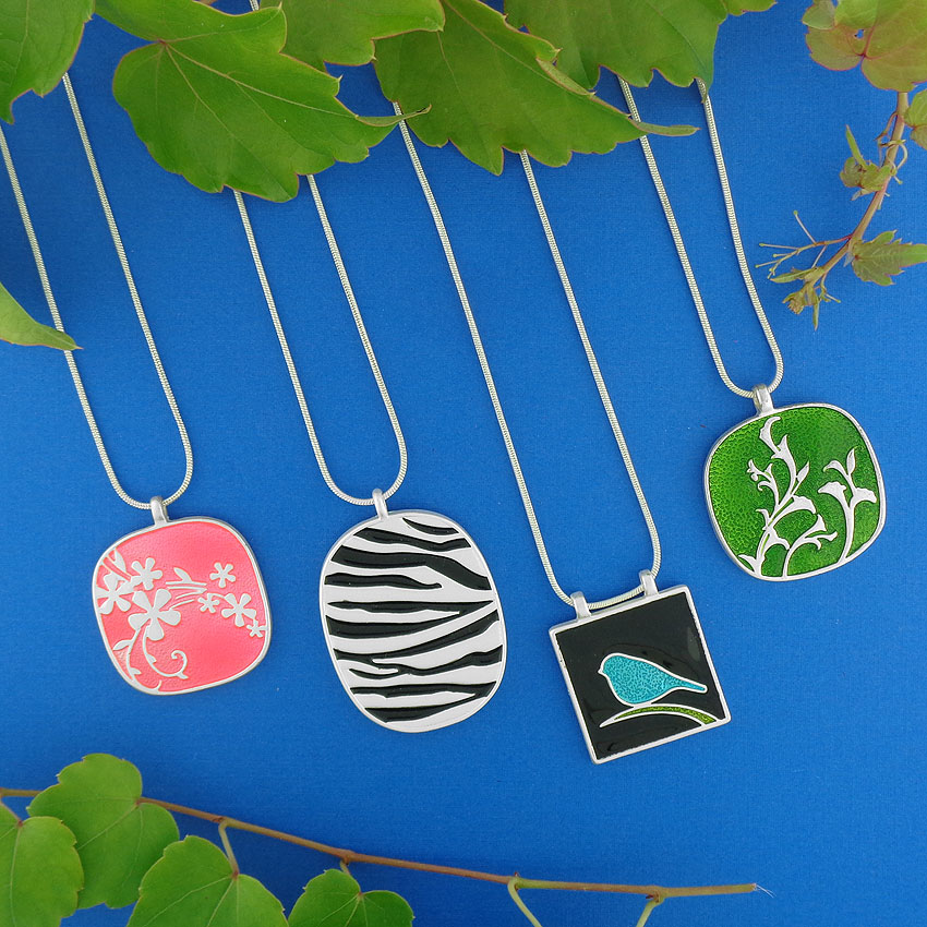 LAVISHY design & wholesale handmade silver plated reversible colorful enamel pendant necklaces to gift shops, clothing & fashion accessories boutiques, book stores and speciality retailers in Canada, USA and worldwide.